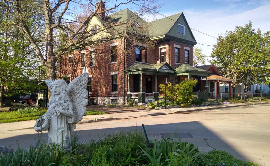 historic home and statue in Twin Towers neighborhood